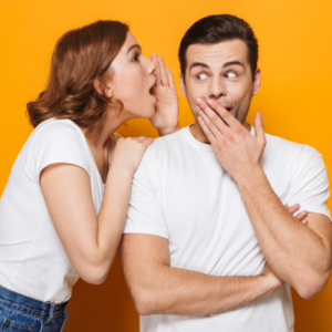 Woman talking to the interpreter telling a secret