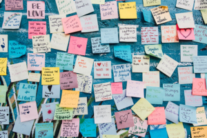 wall of colorful sticky notes with messages and details for interpreter