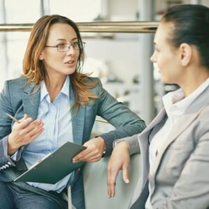 professional woman in suit talking to the interpreter for verification